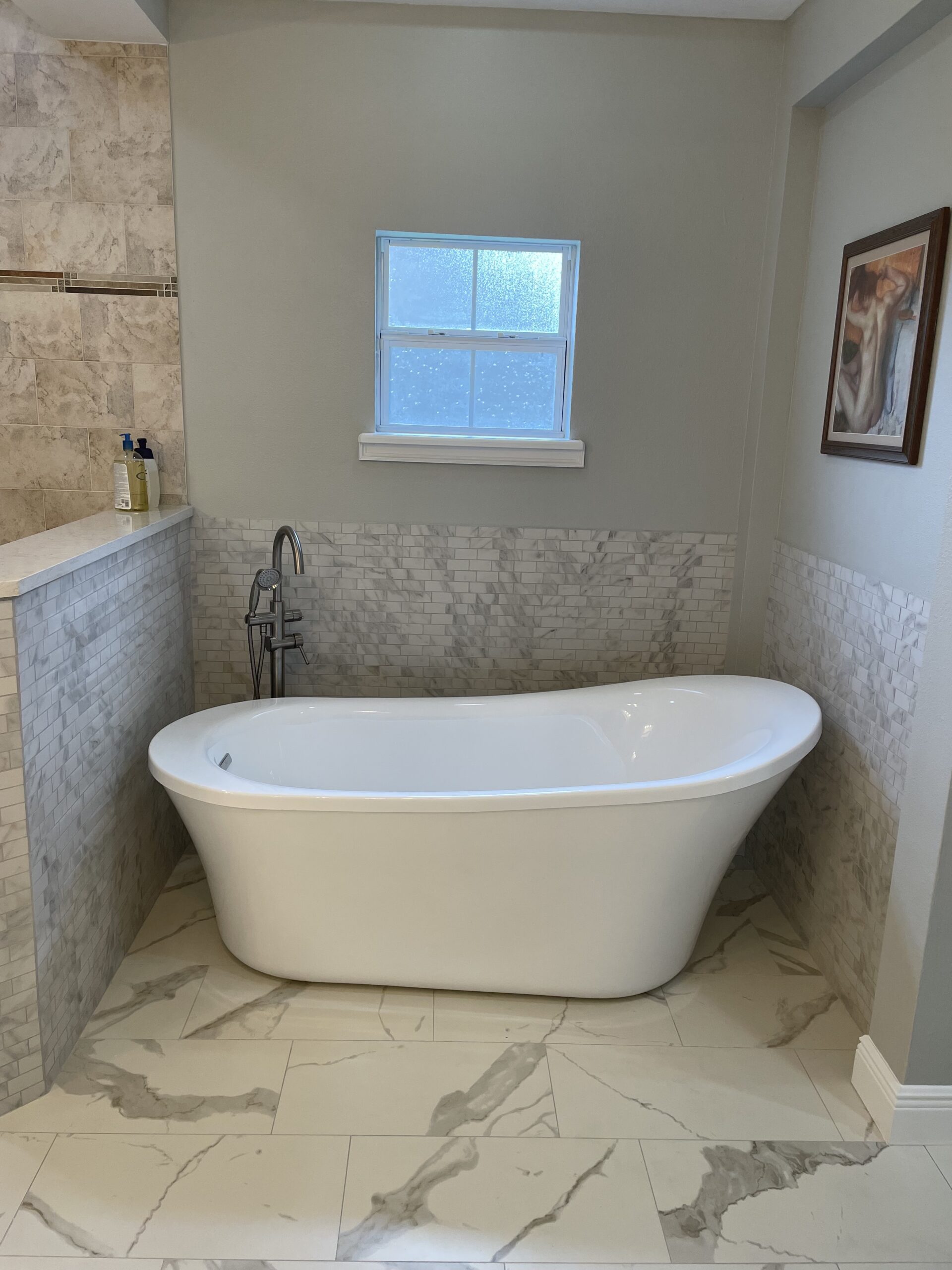 Modern freestanding bathtub installation in a renovated Apopka bathroom.